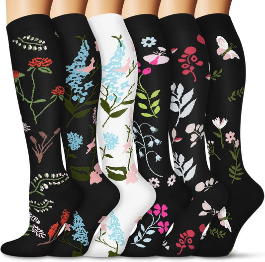 Pairs of long tube compression sports socks in a variety of stylish color combinations