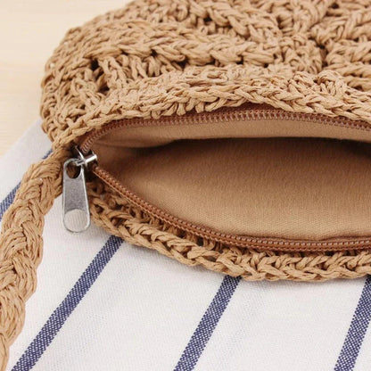 Bohemian rattan round crossbody bag in beige color with tassel accent, perfect for summer outings and beach parties