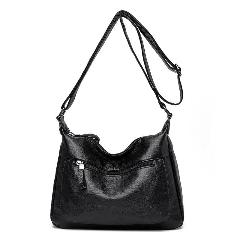 Stylish one-shoulder messenger bag in various colors with a soft, supple PU leather exterior and a spacious, organized main compartment