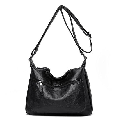 Stylish one-shoulder messenger bag in various colors with a soft, supple PU leather exterior and a spacious, organized main compartment