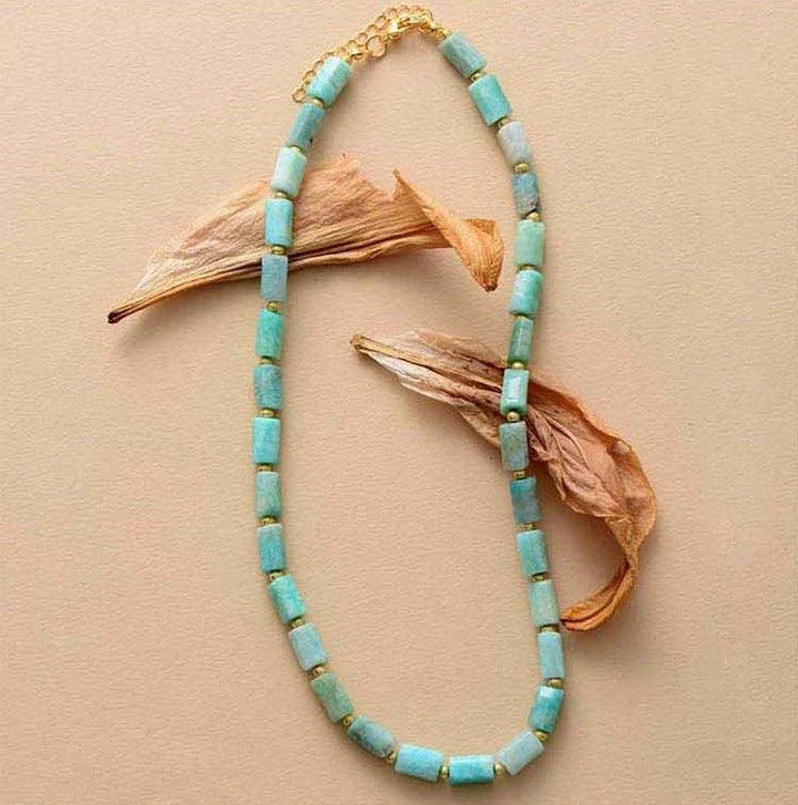 Elegant red natural stone necklace with an adjustable stainless steel chain, perfect for adding a touch of natural beauty to any outfit.