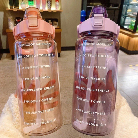 Motivational 2L Straw Water Bottle with time and volume markers, pop-up silicone straw, and wide mouth design for fruit infusions