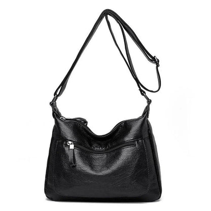 Stylish one-shoulder messenger bag in various colors with a soft, supple PU leather exterior and a spacious, organized main compartment