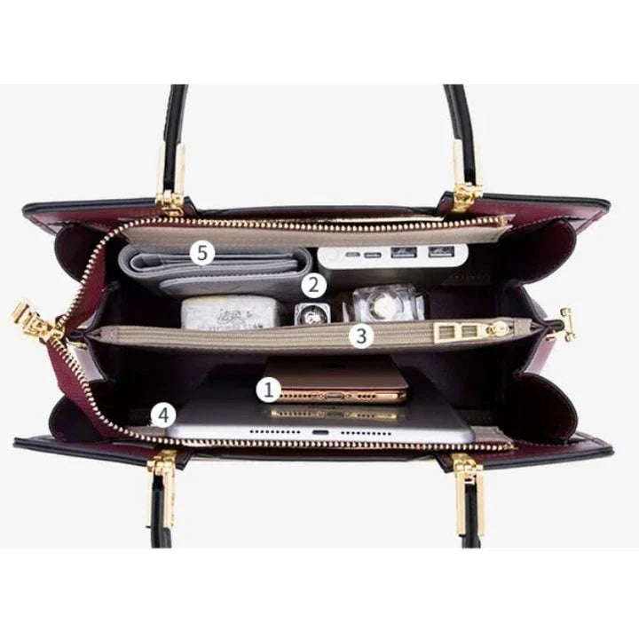 Elegant and spacious black leather tote bag with multiple compartments and a luxurious design