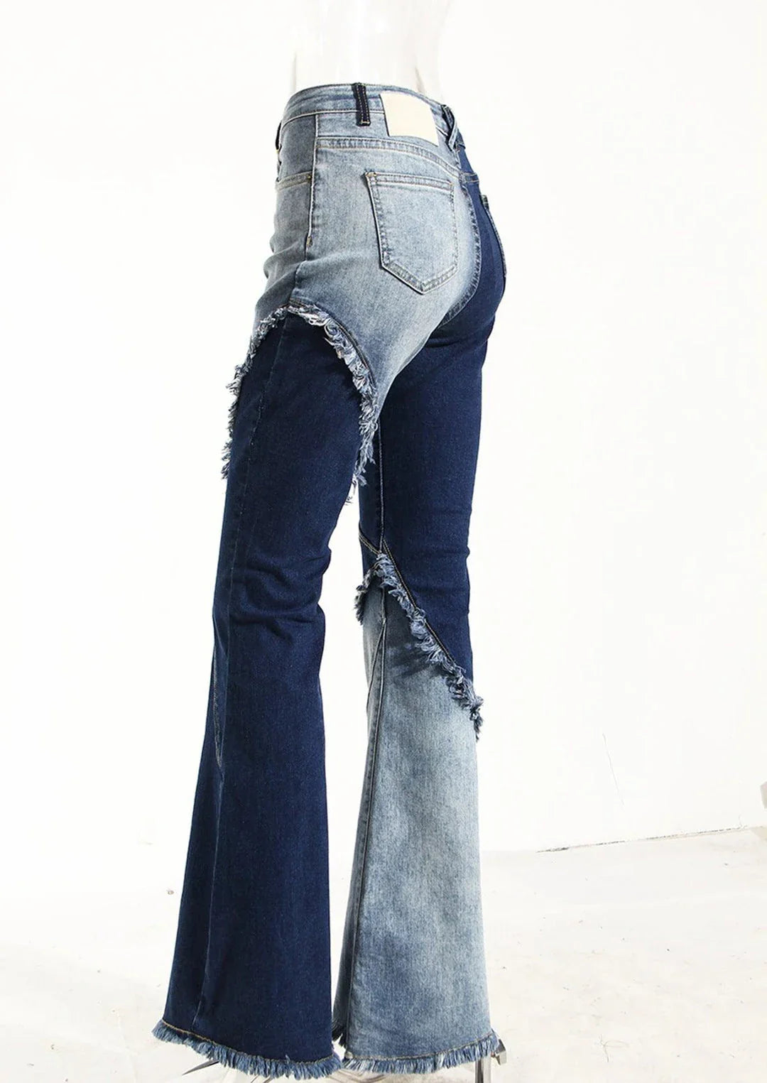 Geometric raw edge jeans with high-waisted, slimming design in blue denim