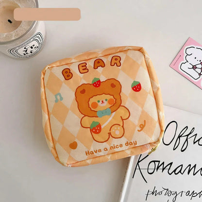 Adorable cartoon nylon cosmetic bag with secure zipper closure and compact, box-shaped design