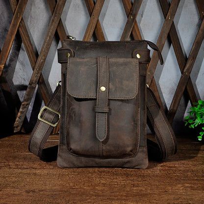 A premium cowhide leather shoulder bag with a compact and versatile design, suitable for various occasions and outdoor activities.