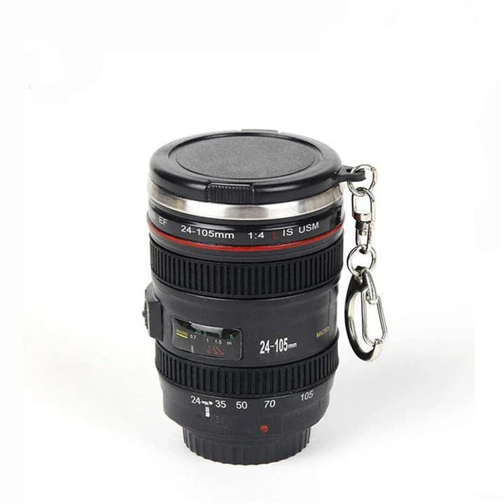 Stylish stainless steel and plastic shot glass with a miniature camera lens design, perfect for adding a unique touch to your home bar or cocktail setup.