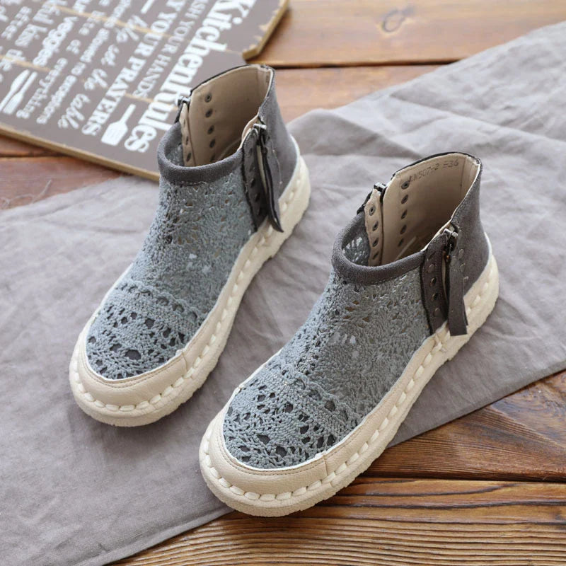 Flat-soled women's Martin boots in grey and beige colors, featuring a denim upper and rubber sole for comfortable, everyday wear.