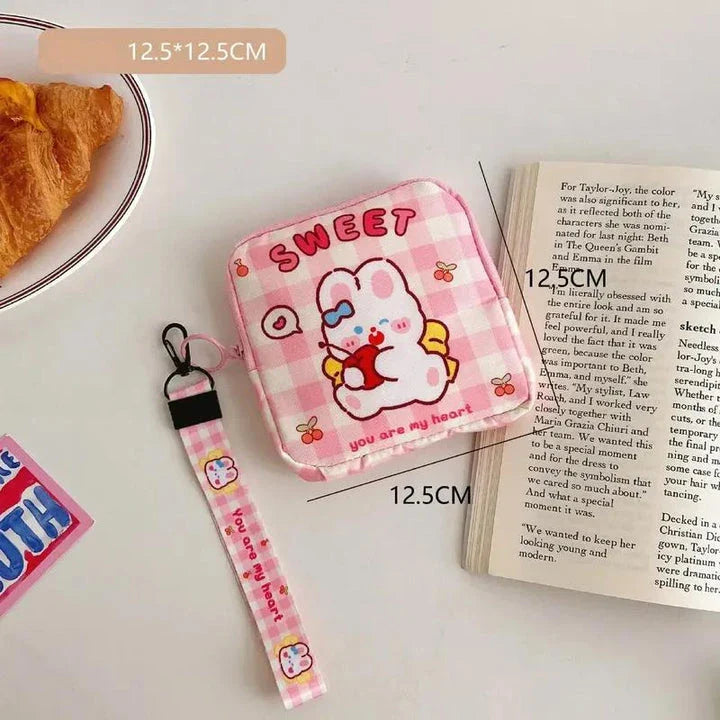 Adorable cartoon nylon cosmetic bag with secure zipper closure and compact, box-shaped design
