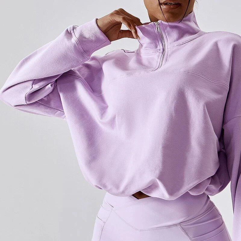 Cozy cotton pullover with zipper detail, available in purple, black, and gray colors