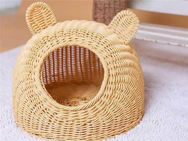 A cozy round woven pet bed made of premium wicker with a soft, plush interior for maximum comfort and style.