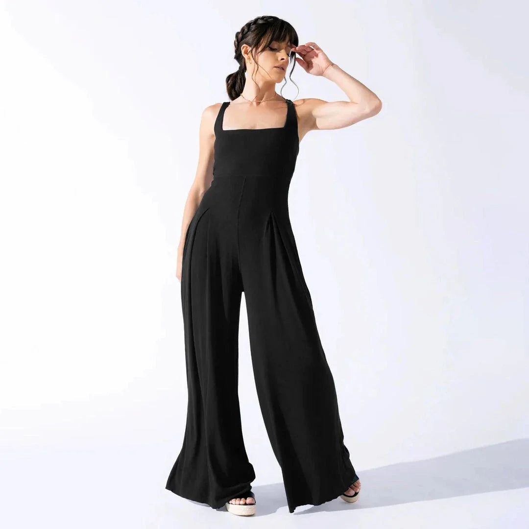 Chic sleeveless jumpsuit with wide-leg pants, made with Rayon and Spandex for comfort and breathability.