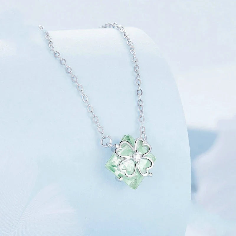 Elegant platinum-plated adjustable green pendant necklace with a sleek, silver-toned chain and a stylish green pendant