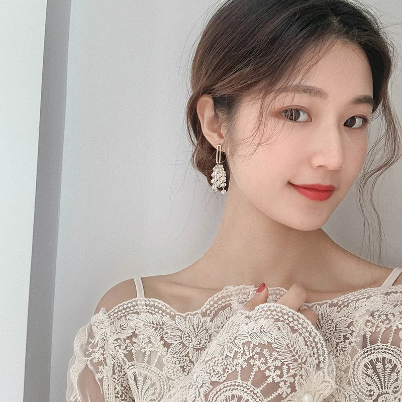 Elegant Crystal Tassel Grape Earrings in Gold, featuring a sophisticated geometric design and a mesmerizing crystal tassel detail