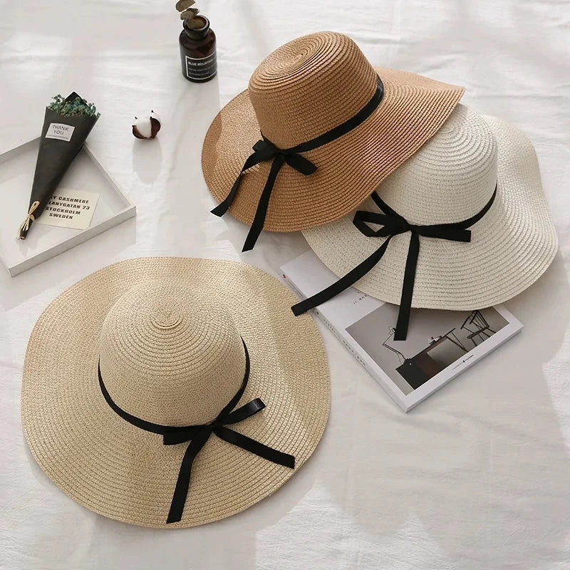 Fashionable summer straw hat for women with wide brim and bow detail, providing UV protection and stylish look