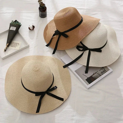 Fashionable summer straw hat for women with wide brim and bow detail, providing UV protection and stylish look