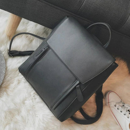 Versatile British-inspired shoulder bag made from high-quality PU leather with a spacious main compartment, convenient pockets, and an adjustable strap