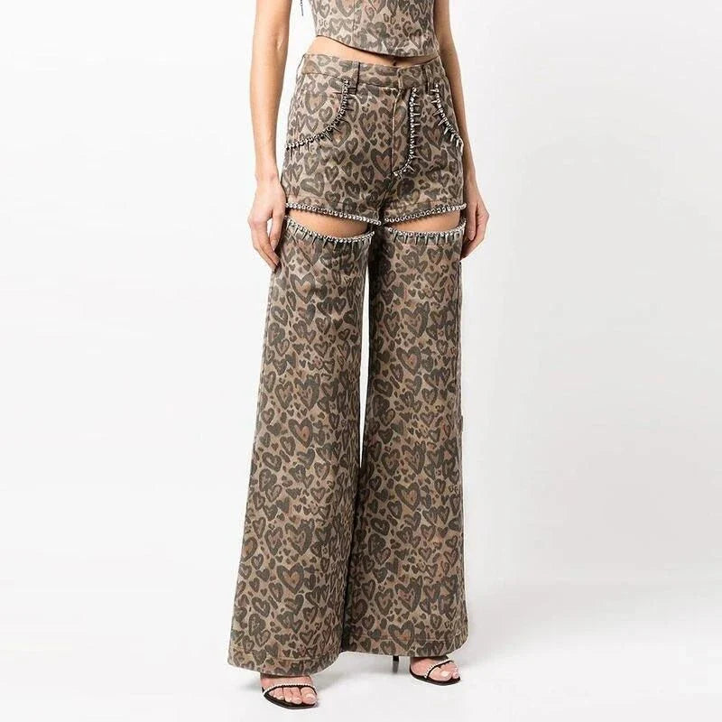 Chic high-waisted patchwork leopard print denim trousers with rivet details and wide-leg silhouette