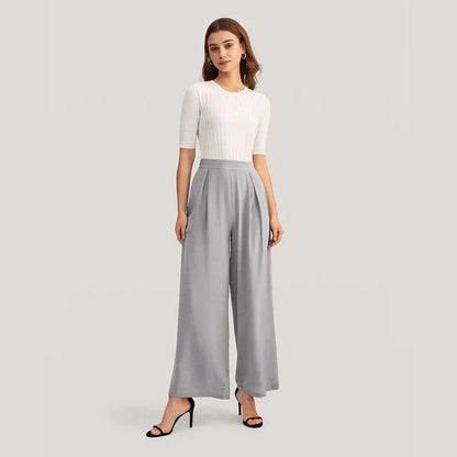 Elegant grey silk wide-leg pants with a high-waist design and concealed side zipper for a flattering, comfortable fit.