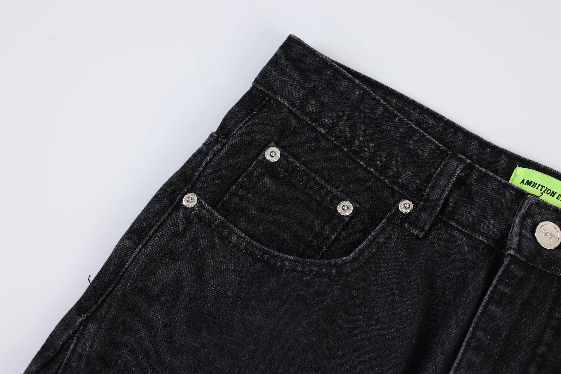 Premium loose fit distressed denim trousers for men and women, featuring a relaxed silhouette, high-quality cotton construction, and trendy distressed details.
