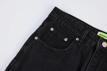 Premium loose fit distressed denim trousers for men and women, featuring a relaxed silhouette, high-quality cotton construction, and trendy distressed details.