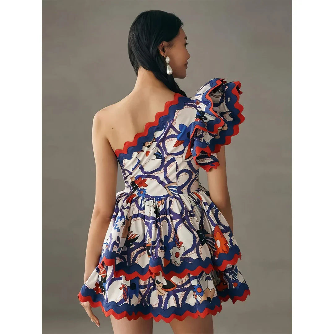 Fashionable sleeveless mini dress with ruffled details and vibrant floral print