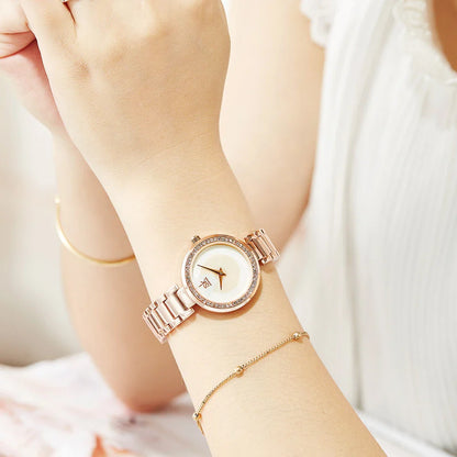 A fashionable stainless steel women's watch with diamond accents, waterproof design, and a modern quartz movement.