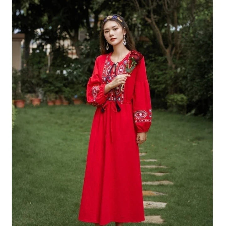 Elegant embroidered cotton-linen dress with tassels, featuring a waist-cinching A-line silhouette in vibrant colors