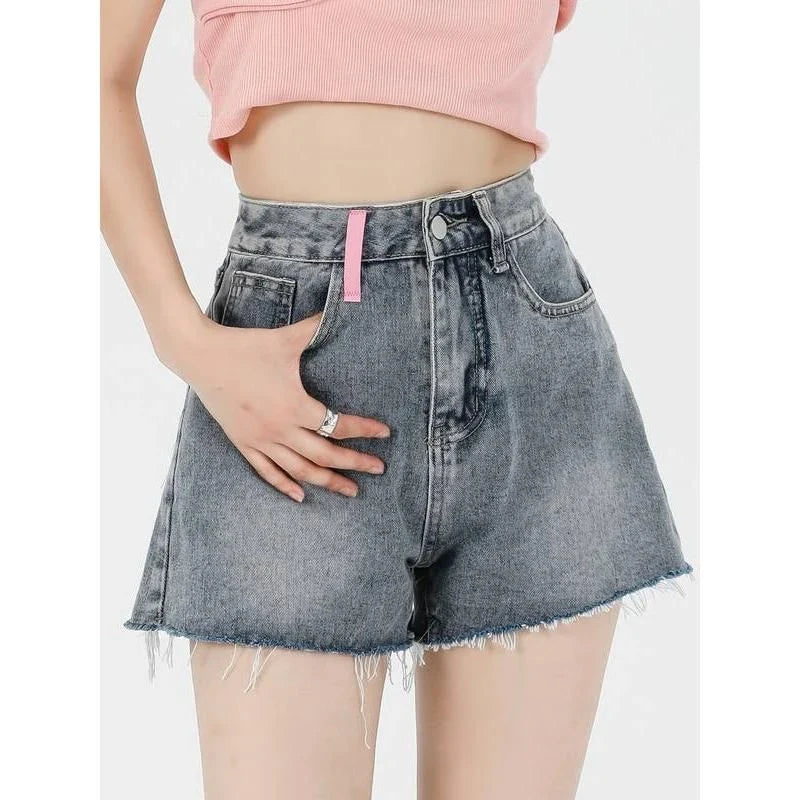 Premium high-waist denim shorts with charming embroidered details, perfect for summer fashion