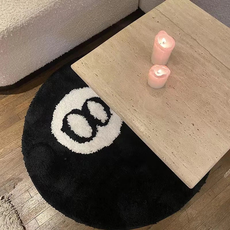 A round, soft rug with a spooky 8 ball design, perfect for adding a unique, eerie accent to any room.