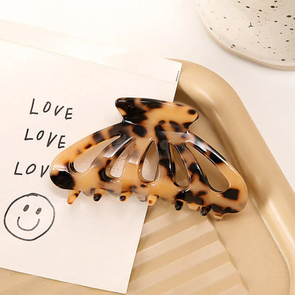 Stylish geometric hollow stripes barrettes in beige color, a fashionable hair accessory for women and girls