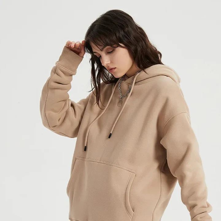 Cozy Fleece Hoodie and Sweatpants Set in Light Pink, featuring a relaxed fit and hooded design for maximum comfort and style.