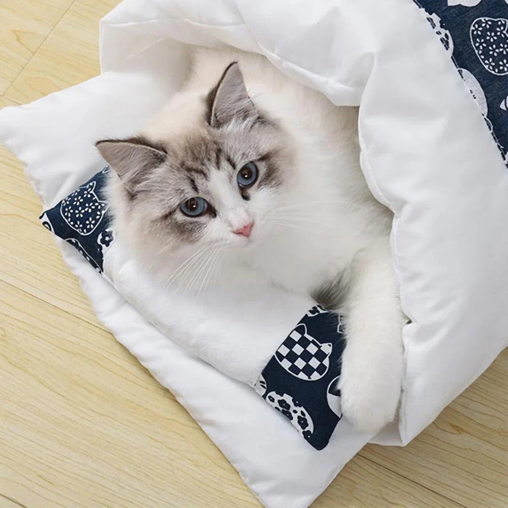Cozy cat cave bed with a printed design, providing a plush and secure retreat for your feline friend.