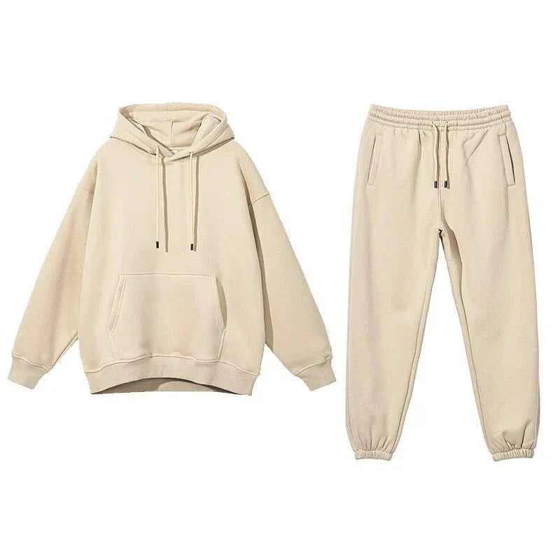 Cozy Fleece Hoodie and Sweatpants Set in Light Pink, featuring a relaxed fit and hooded design for maximum comfort and style.