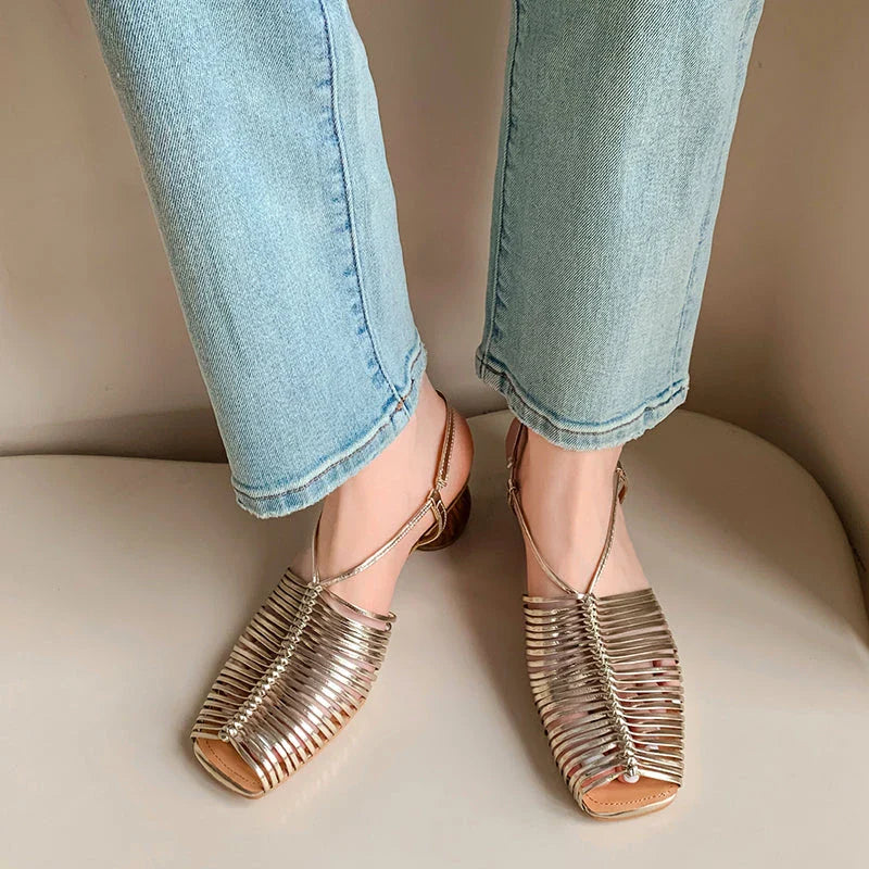 Stylish high heel genuine leather sandals in silver color with ankle strap and fashionable buckle closure