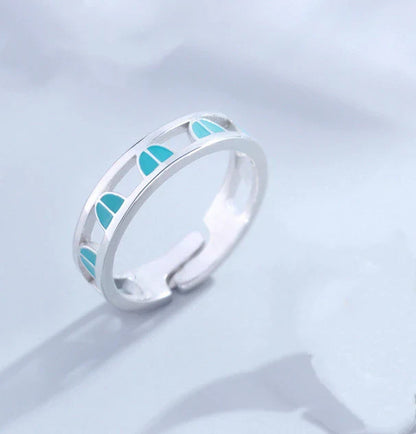 Adjustable couple rings in sterling silver with a celestial design of stars, moons, and clouds