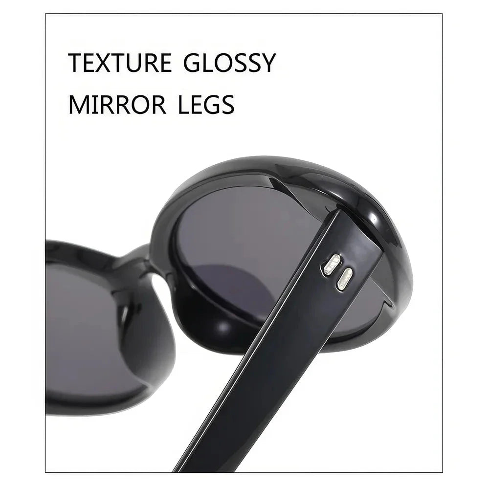 Chic oval sunglasses with white grey acetate frames and polycarbonate lenses, designed for fashionable women to shield their eyes from UV rays in style.