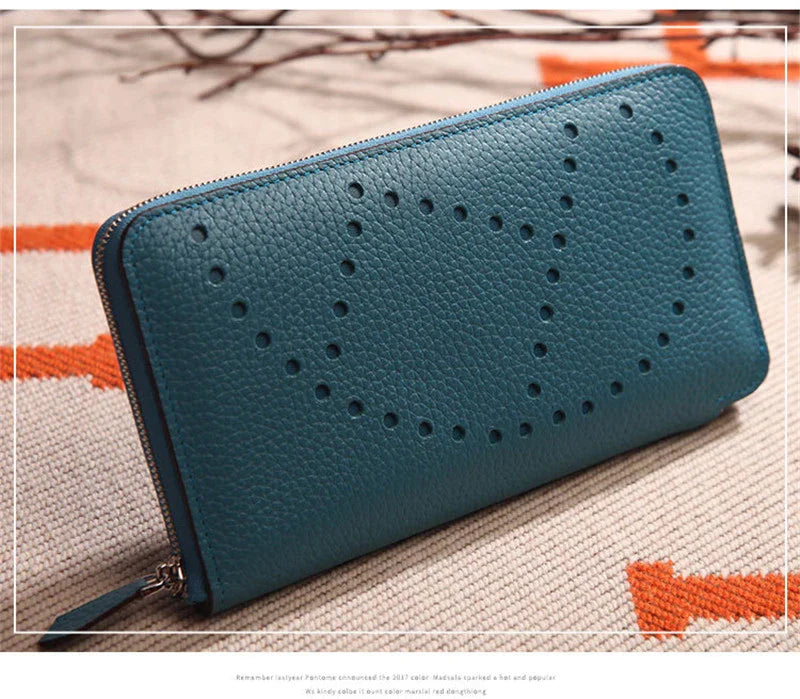 Premium cowhide leather clutch bag with lychee pattern design, featuring a medium-sized square shape and versatile style