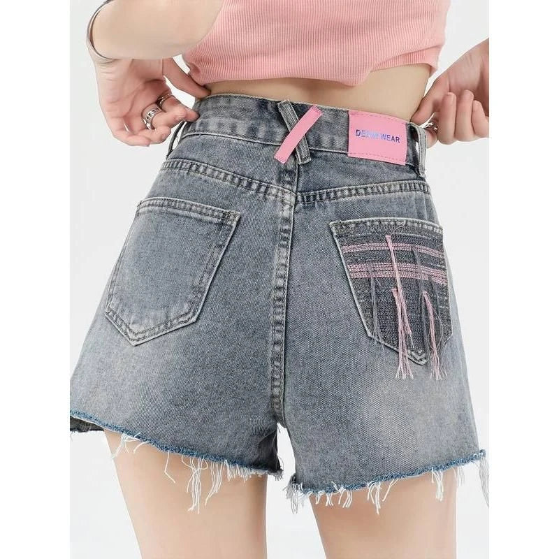 Premium high-waist denim shorts with charming embroidered details, perfect for summer fashion