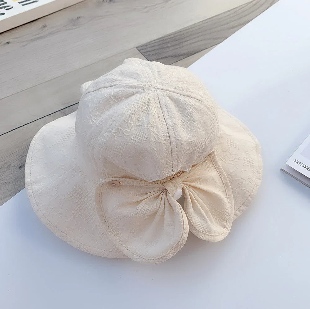 Adorable princess-inspired baby bucket hat with soft cotton material and wide brim for sun protection