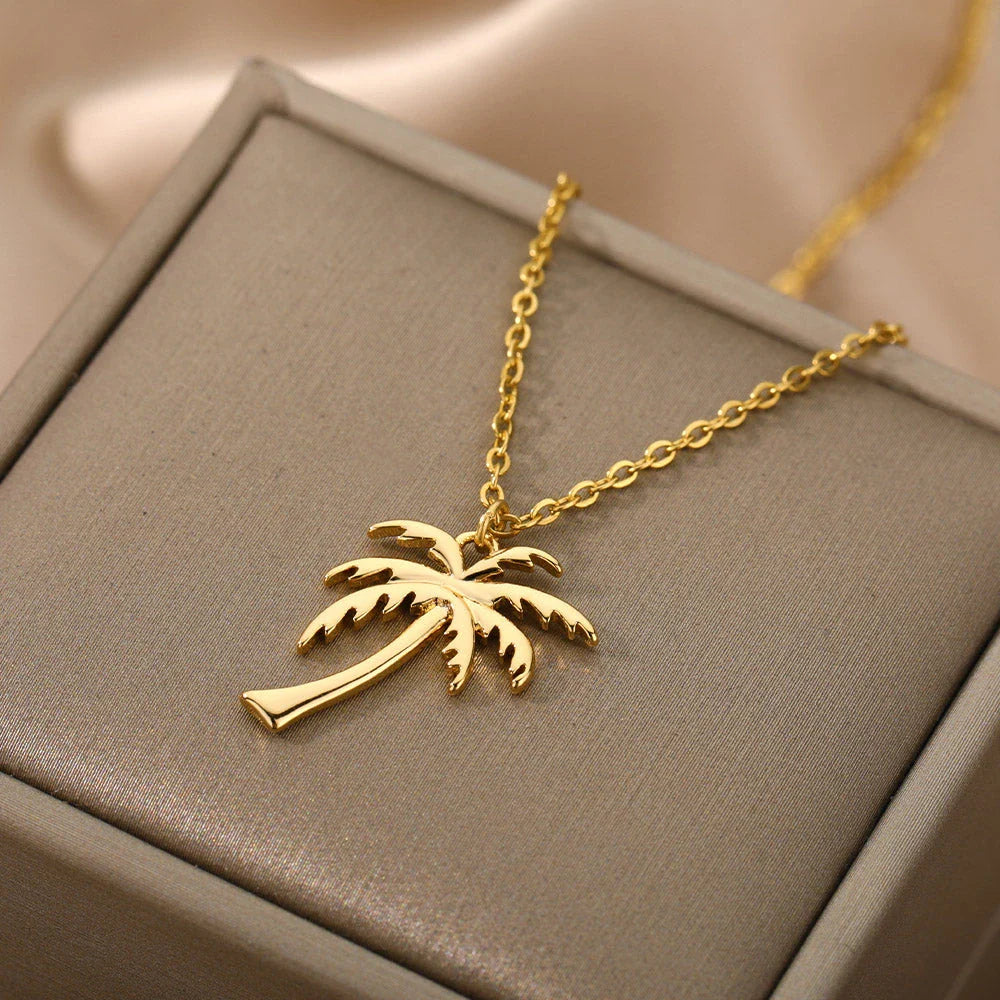 Stainless steel palm tree pendant necklace with sleek chain, perfect for summer beach style and bohemian fashion