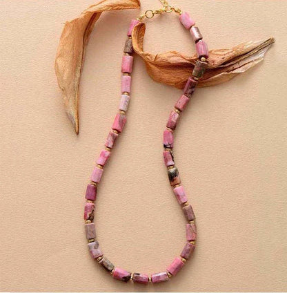 Elegant red natural stone necklace with an adjustable stainless steel chain, perfect for adding a touch of natural beauty to any outfit.
