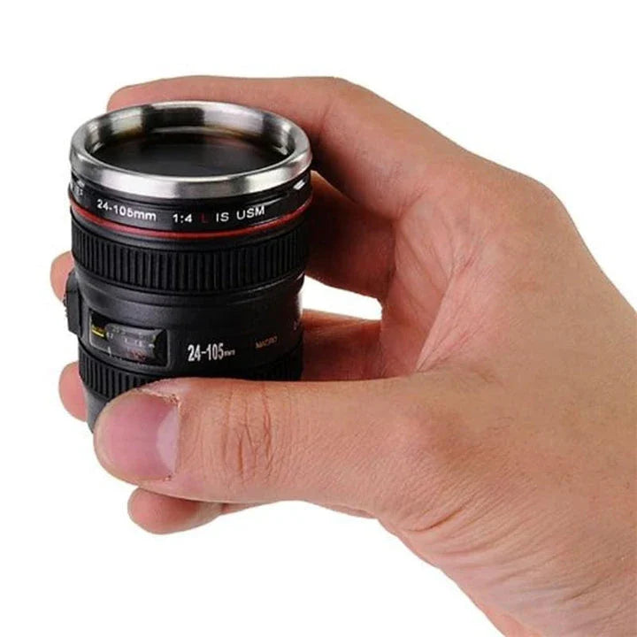 Stylish stainless steel and plastic shot glass with a miniature camera lens design, perfect for adding a unique touch to your home bar or cocktail setup.