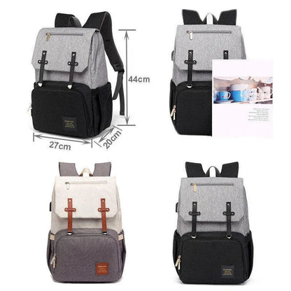 Premium diaper backpack with insulated pockets, stroller attachment, and USB charging port