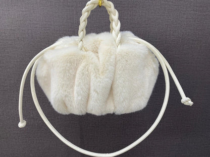 Elegant pleated leather and mink fur handbag in various colors, featuring a chic and modern cloud-like design