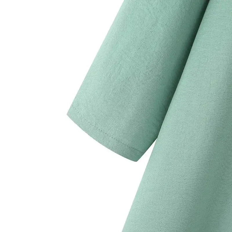 Elegant polyester dress with long sleeves, high slit hem, and available in caramel, black, blue, green, and pink colors