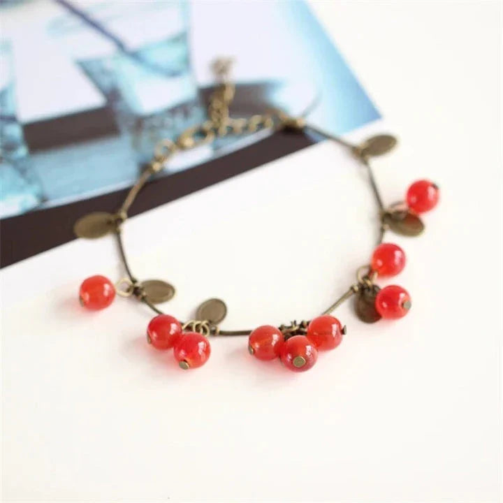 Boho vintage-inspired cherry coin bracelet with adjustable lobster-claw clasp, perfect for girls' summer fashion
