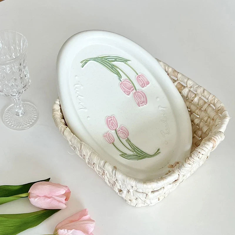 Elegant ceramic plate featuring a delicate floral relief design of Calla Lily and Tulip flowers, perfect for refined dining