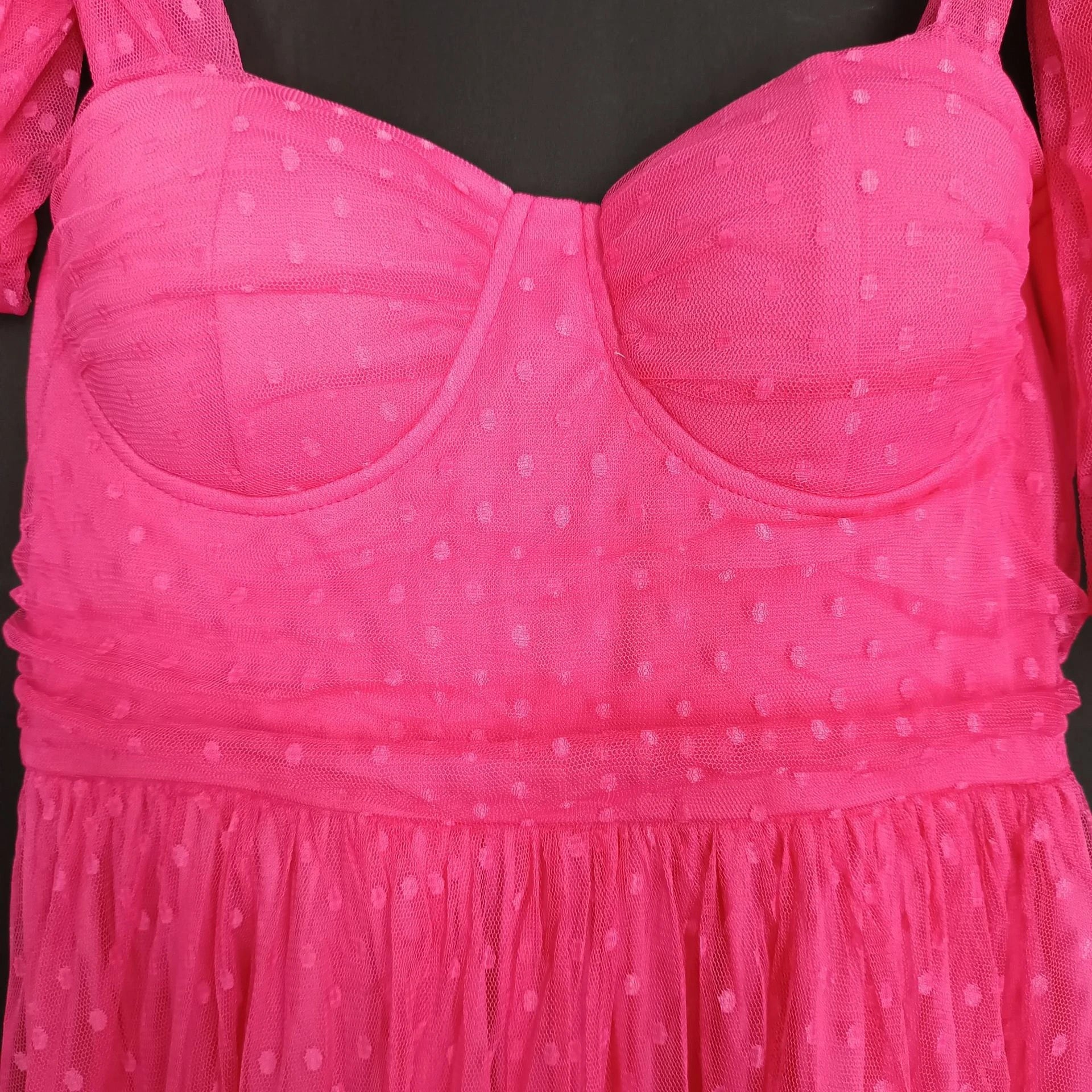 Fairy-inspired dress with mid-length silhouette, lace-up details, and luxurious polyester fabric